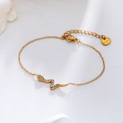 Gold chain bracelet with snake