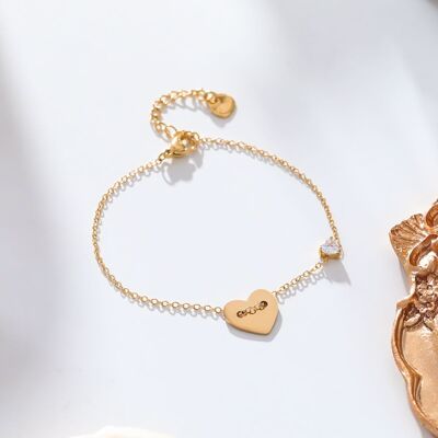 Golden chain bracelet with heart and rhinestones
