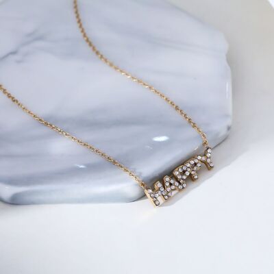 Golden chain necklace with happy pendant