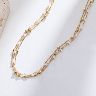 Goldene Halskette mit mehreren Ketten, Perlen und Kugeln