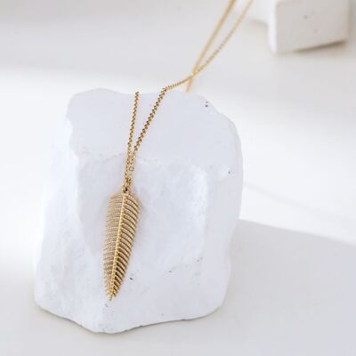 Gold chain necklace with feather pendant