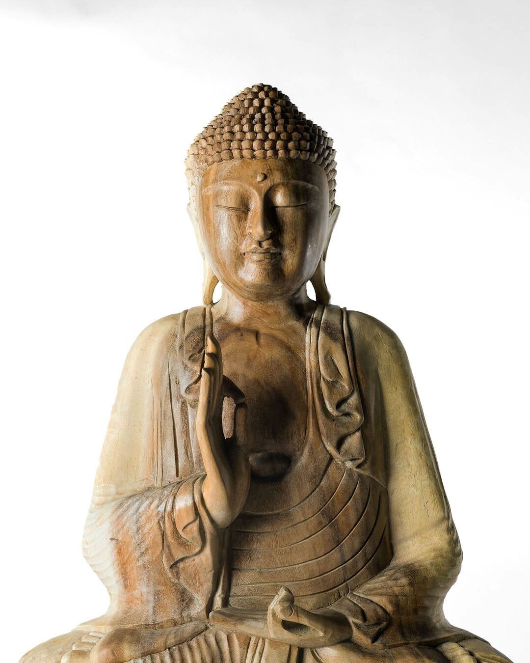 Natural wooden statue of decorative Samán Buddha, hand-carved by artisans in a single piece in various sizes with different heights, made in Indonesia