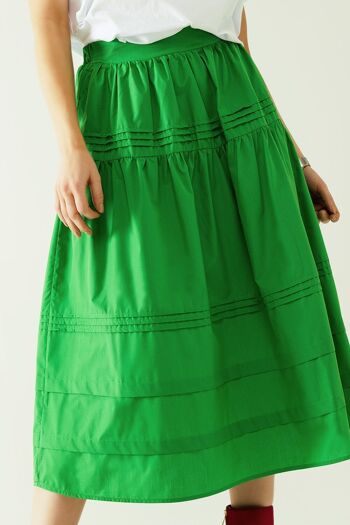 Falda midi de papelina escalonada avec détails de costumes en vert 5