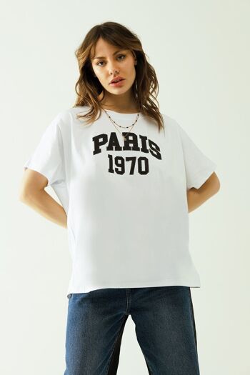 Camiseta oversize blanca estampada paris 1970 en negro 4