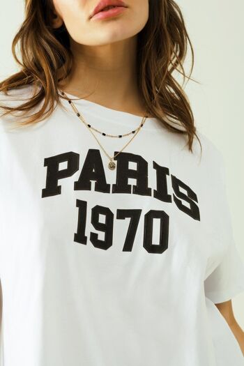 Camiseta oversize blanca estampada paris 1970 en negro 5
