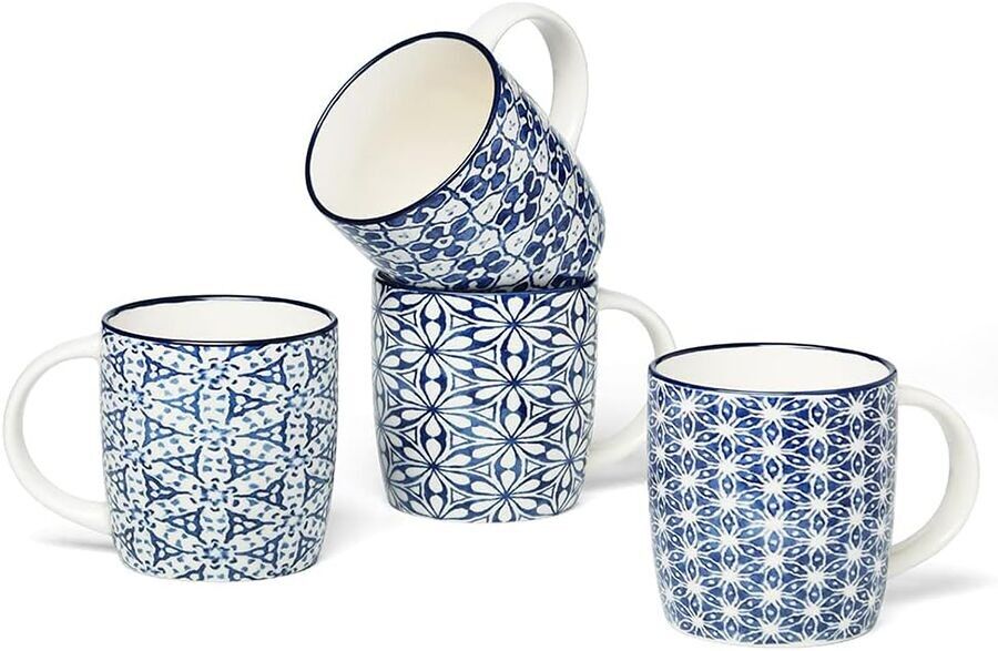 Ceramic mug with blue and white geometric shapes in 4 designs. Dimension: 8.5x9x7cm Capacity: 350ml LM-311