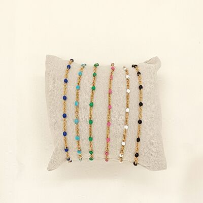 Set of 6 colorful gold chain bracelets on cushion