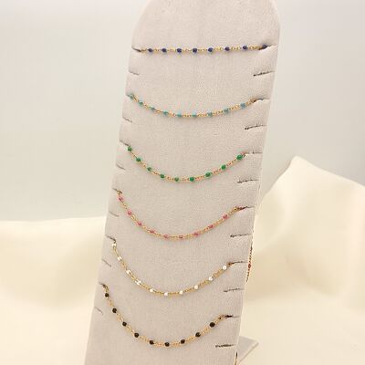 Set of 6 colorful gold chain necklaces on display