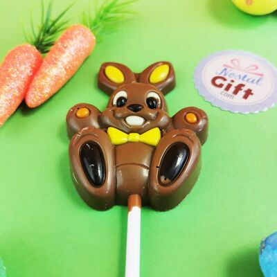 Orange and yellow Easter bunny lollipop with milk chocolate