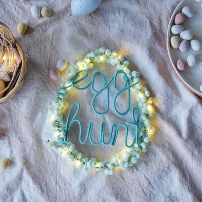 Letrero luminoso de búsqueda de huevos de Pascua