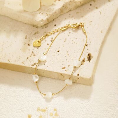 Golden chain bracelet with white stones