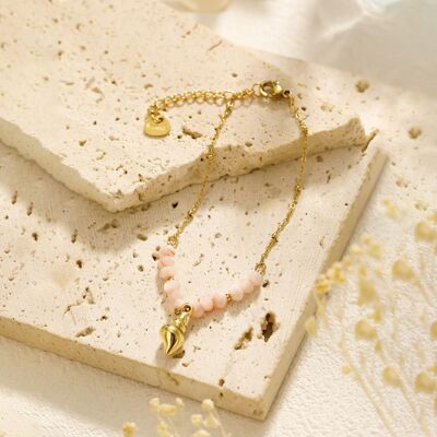 Golden chain bracelet with pink stones and pendant