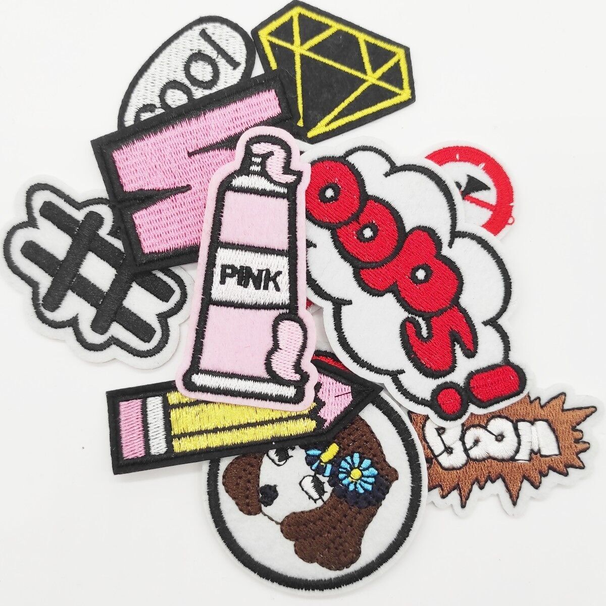 lotto di 100 toppe termoadesive Oops