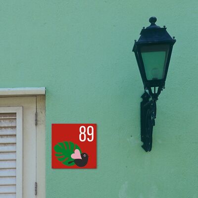 Placa de casa con número de pájaro