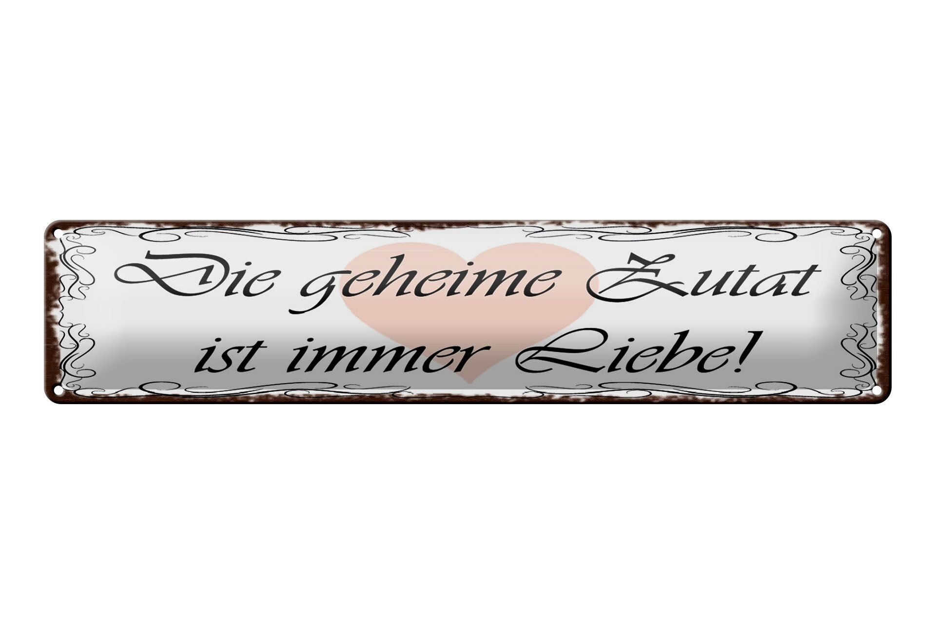 Targa in metallo da 46x10 cm che dice che l'ingrediente segreto è sempre la decorazione dell'amore