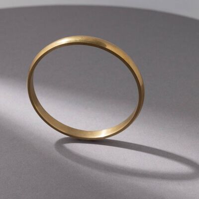 Wide, solid bangle made of handmade brass