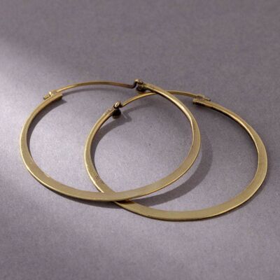 Large asymmetrical hoop earrings gold