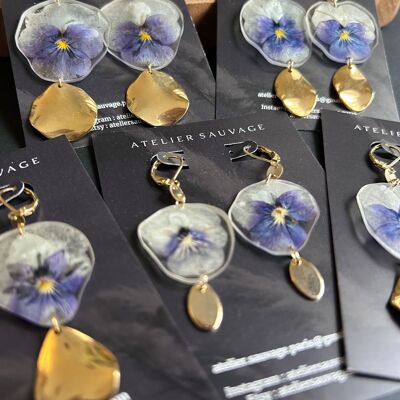 Earrings and pansy flower