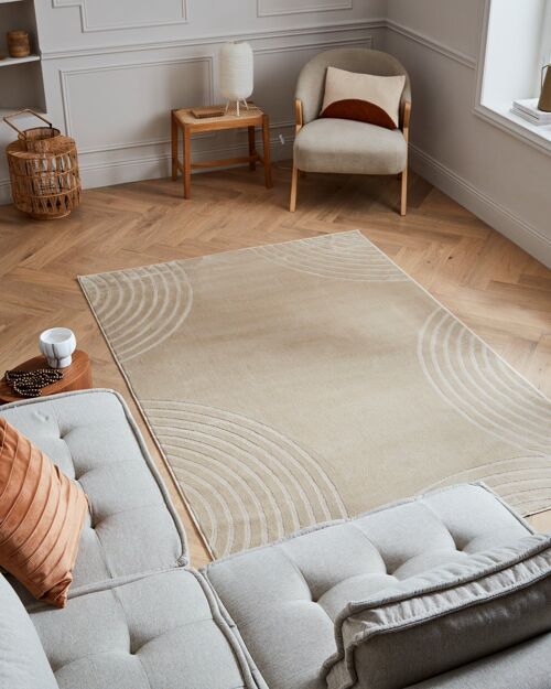 Tapis poils ras motif arc en relief beige