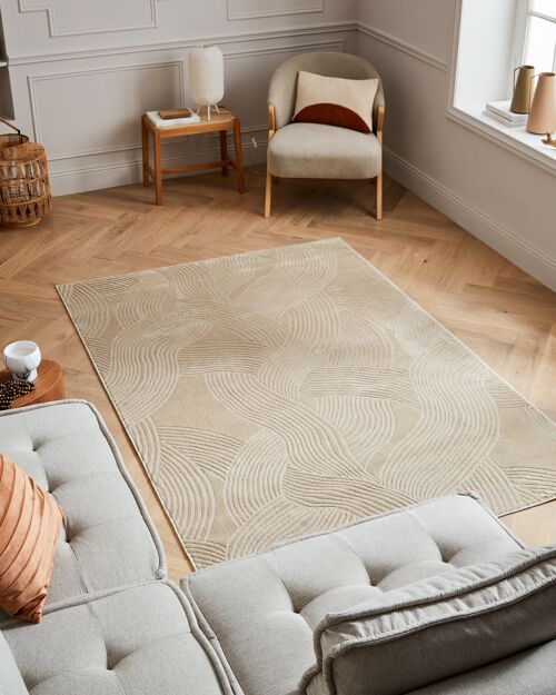 Tapis poils ras motif abstrait en relief beige