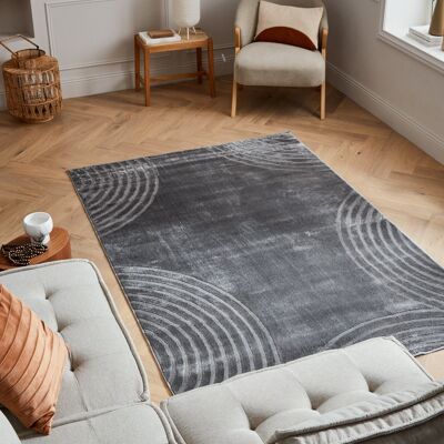 Low pile carpet with gray embossed arc pattern