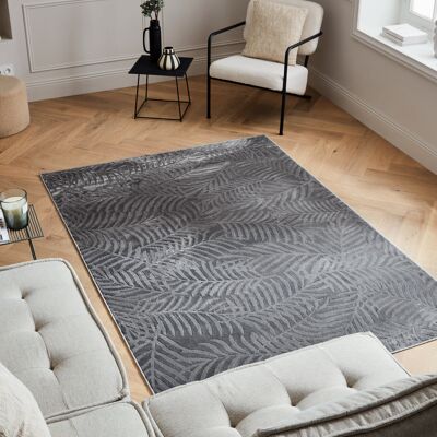 Low pile carpet with gray embossed leaf pattern