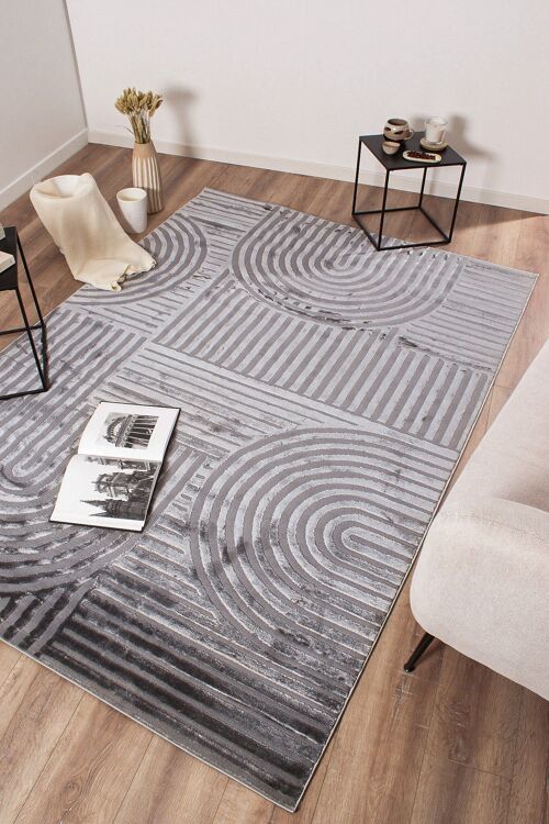 Tapis motif en relief gris