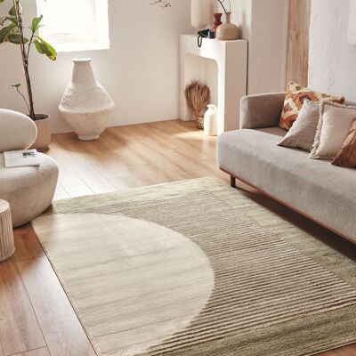 Short pile living room rug with green semicircle pattern