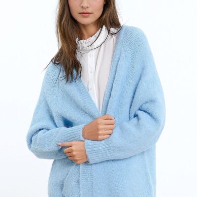 Die Strickjacke wurde von Punto Esponjoso abiert und entspannte sich in einem blauen Baby mit Kanal in seinen Augen und Puños