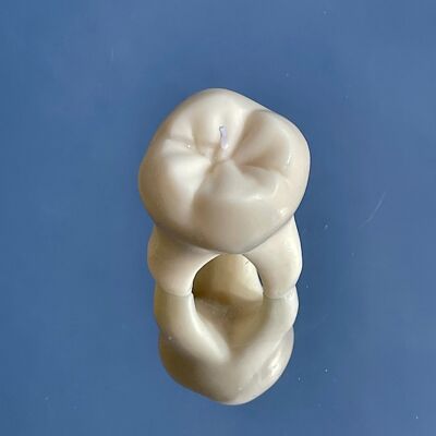Candela a forma di dente