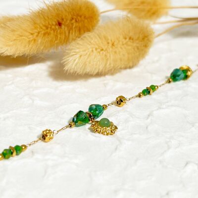 Golden chain bracelet with green sun