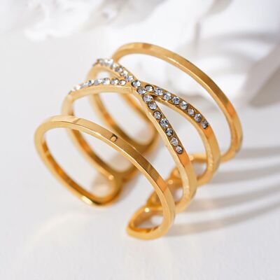 Golden multi-line crossed ring with rhinestones