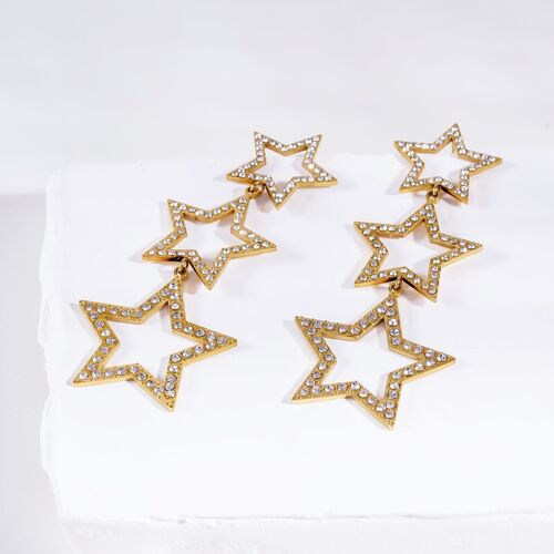 Boucles d'oreilles dorées pendantes triple étoiles à strass