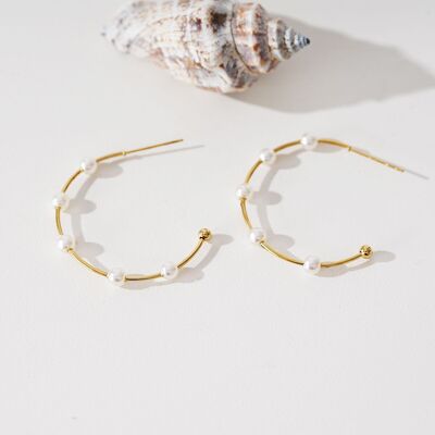 Gold open hoop earrings with five pearls
