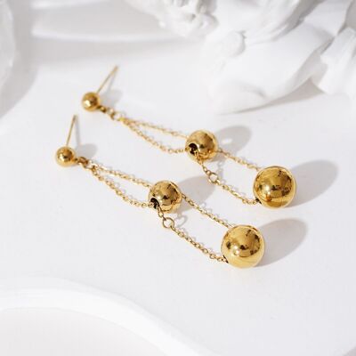 Golden dangling chain and double ball earrings