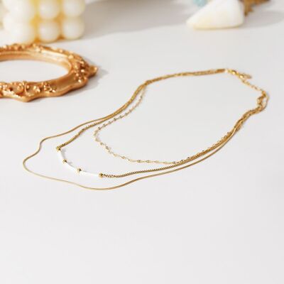 Golden triple chain necklace with white stones