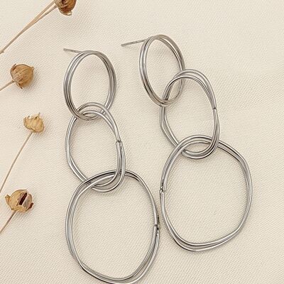 Boucles d'oreilles argentées pendantes ovales irréguliers
