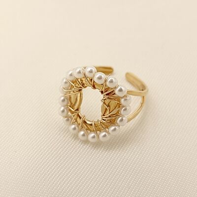 Golden circle ring surrounded by pearls