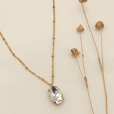 Gold necklace with white rhinestone pendant