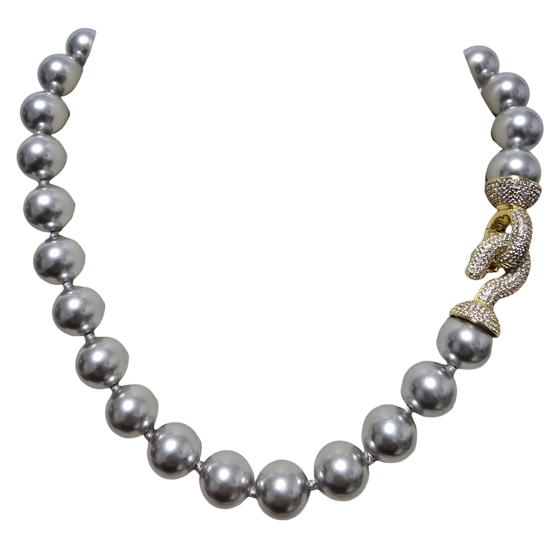 Collana a nodi perla grigia susta oro con zirconi