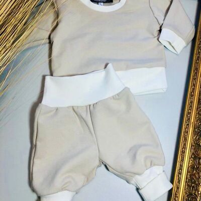 Ensemble bébé uni composé d'un pull et d'un pantalon rose ou beige