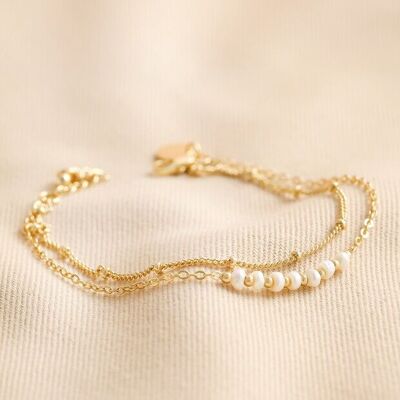 Pulsera de doble cadena con perlas de agua dulce en oro