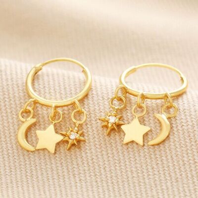 Pendientes de aro Huggie con dije celestial