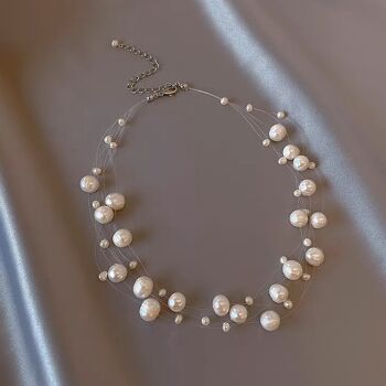 Étoiles nacrées - Collier de mariée en perles d'eau douce baroques ligne transparente 9