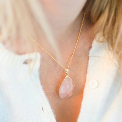 Rose quartz and gold pendant