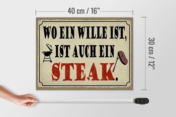 Panneau en bois indiquant 40x30cm où il y a un panneau décoratif pour steak grill 4