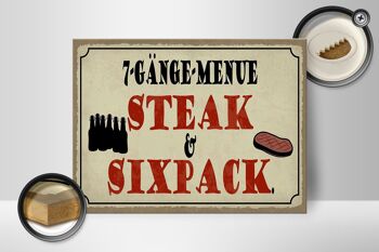 Panneau en bois indiquant 40x30cm, menu à 7 plats, steak, six pack, panneau de grill 2