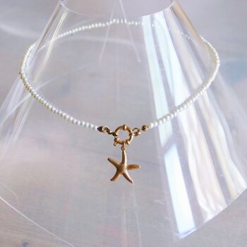 Collier de perles avec cadenas rond et étoile de mer - doré