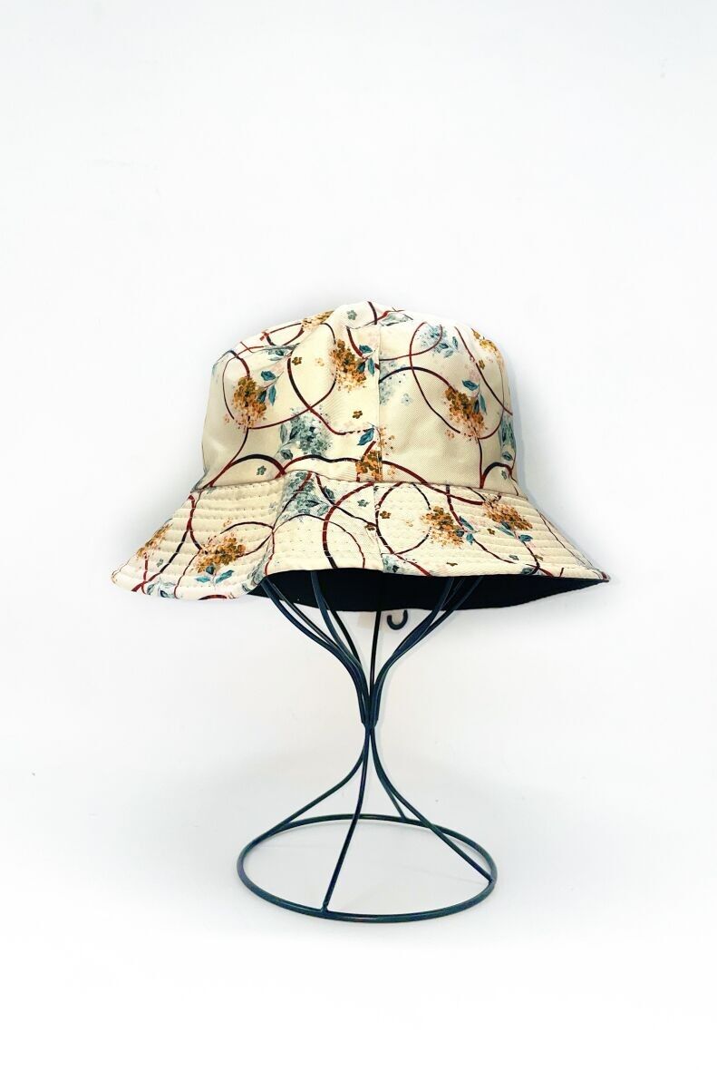 Cappello da pescatore reversibile con stampa geometrica e floreale