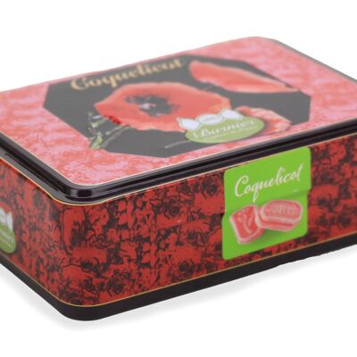 Frosted poppy candies in metal tin